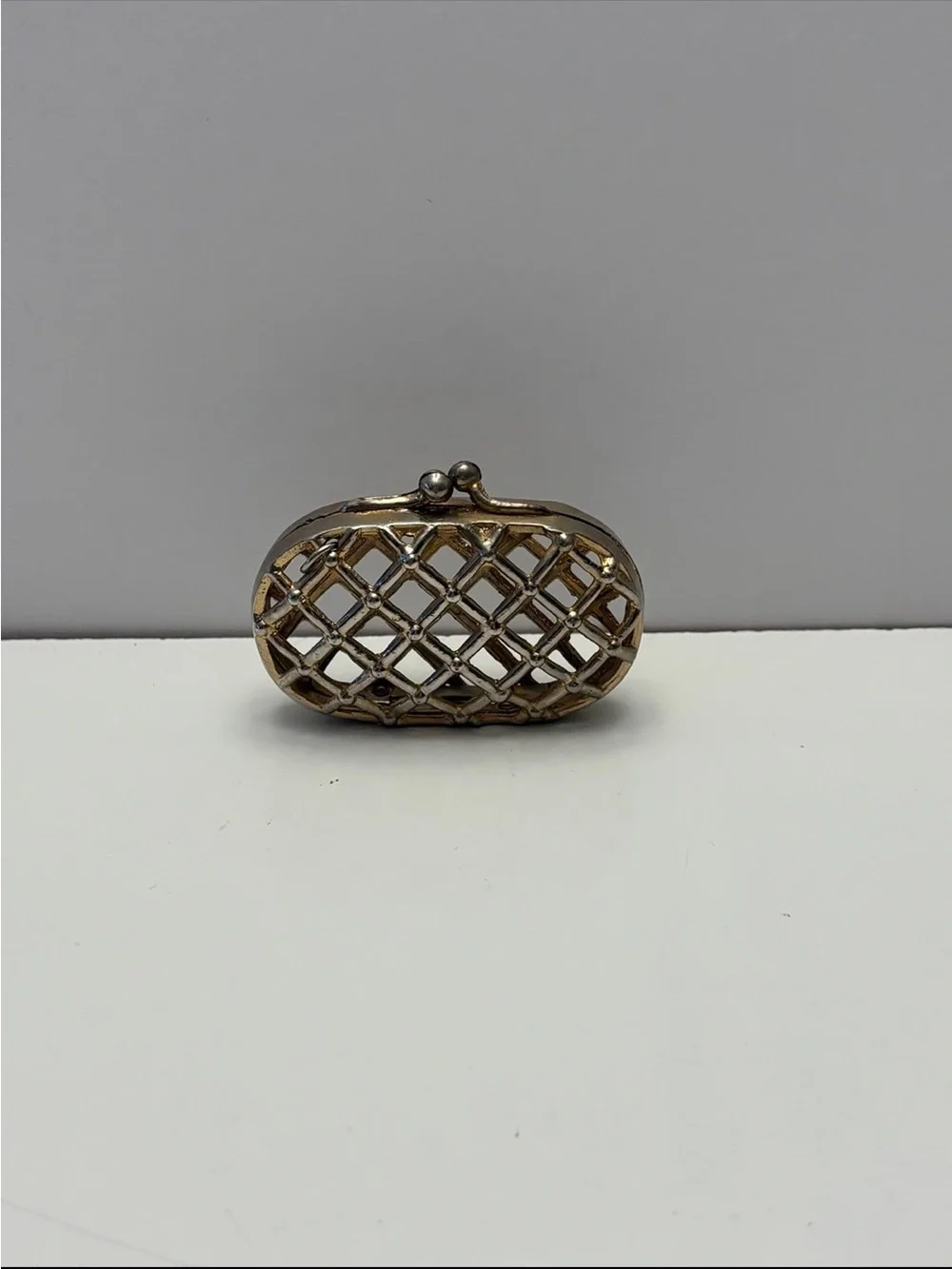 vintage metal cage or lattice-design mini coin clutch